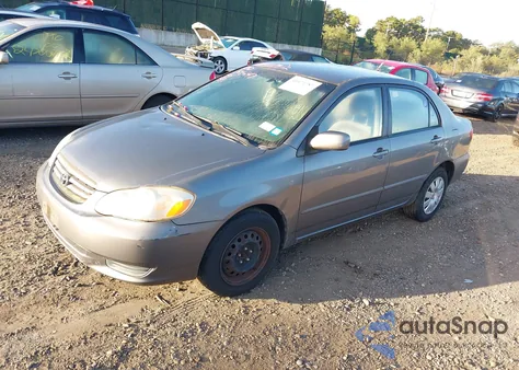 2004 Toyota Corolla Le z USA, uszkodzony, nr VIN 2T1BR38E64C257658